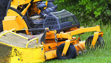 standing lawn mower image